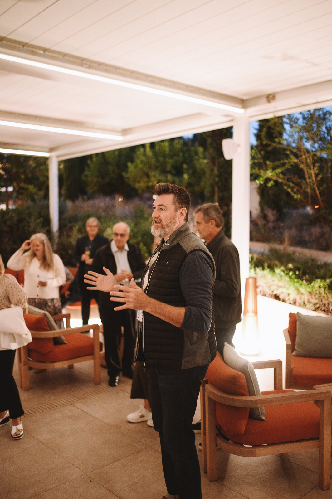 Tony Wood speaking during an evening discussion in Greece.